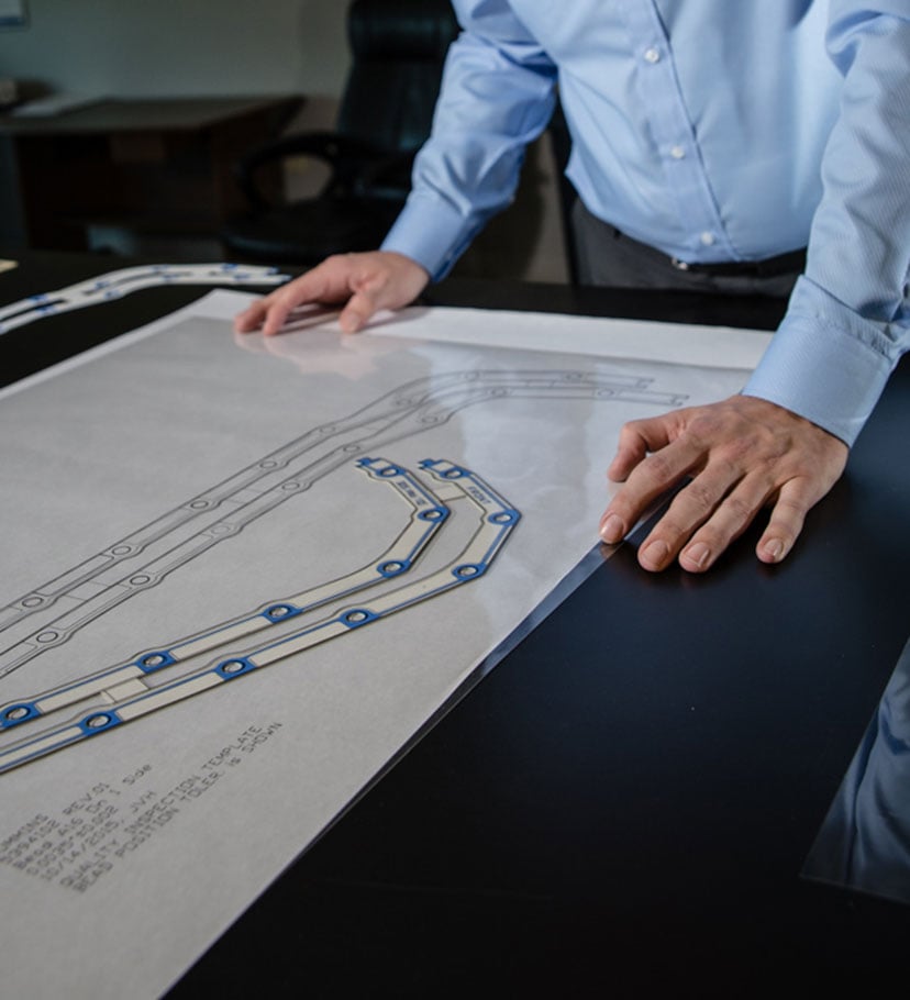 Engineer evaluating gasket plans
